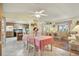 Dining area with adjacent kitchen and living room, lots of natural light at 9445 Barnstead Ln, Port Richey, FL 34668