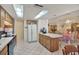 Kitchen with wood cabinets, island and appliances at 9445 Barnstead Ln, Port Richey, FL 34668
