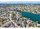 Aerial view of houses near a canal and waterfront at 9445 Barnstead Ln, Port Richey, FL 34668
