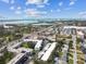 Aerial view showing the community, nearby shopping, and ocean in the distance at 9945 47Th N Ave # 206, St Petersburg, FL 33708