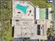 An aerial view of a community pool, shuffleboard, and parking area at 9945 47Th N Ave # 206, St Petersburg, FL 33708