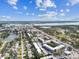 Drone image shows building with neighborhood and waterway in the distance at 9945 47Th N Ave # 206, St Petersburg, FL 33708