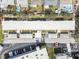 An aerial view showcases building architecture, surrounding landscape and parking at 9945 47Th N Ave # 206, St Petersburg, FL 33708