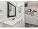 Bathroom with sink, large mirror and adjacent hallway at 9945 47Th N Ave # 206, St Petersburg, FL 33708