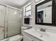 Bathroom featuring a glass-enclosed shower, vanity, and mirror at 9945 47Th N Ave # 206, St Petersburg, FL 33708