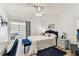 Bright bedroom with blue accents, ceiling fan, and a calming atmosphere at 9945 47Th N Ave # 206, St Petersburg, FL 33708