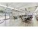Large community room with ample seating, tables, and access to a nearby pool at 9945 47Th N Ave # 206, St Petersburg, FL 33708