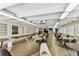 Community room with plenty of tables, seating, and natural light from the many windows at 9945 47Th N Ave # 206, St Petersburg, FL 33708