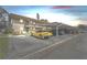 Apartment building with convenient covered parking, car, and tidy landscaping at 9945 47Th N Ave # 206, St Petersburg, FL 33708