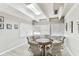 Bright game room featuring a round table, six chairs, and several windows at 9945 47Th N Ave # 206, St Petersburg, FL 33708