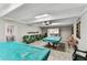 Spacious game room with pool tables and comfortable seating for residents at 9945 47Th N Ave # 206, St Petersburg, FL 33708