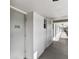 Hallway featuring unit 206 with an overhead light fixture and a view down the shaded hall at 9945 47Th N Ave # 206, St Petersburg, FL 33708