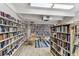 Community library filled with books, shelves, a rocking chair and a blue-striped rug at 9945 47Th N Ave # 206, St Petersburg, FL 33708