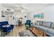 Inviting living room featuring stylish decor, comfortable seating, and seamlessly connects to the kitchen at 9945 47Th N Ave # 206, St Petersburg, FL 33708