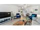 Inviting living space with a modern kitchen view and stylish blue accents for a contemporary feel at 9945 47Th N Ave # 206, St Petersburg, FL 33708