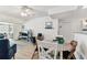 Open-concept living space with dining area, comfortable seating, and lots of natural light at 9945 47Th N Ave # 206, St Petersburg, FL 33708