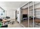 Bright sunroom with comfortable seating and sliding glass doors leading to the main living area at 9945 47Th N Ave # 206, St Petersburg, FL 33708