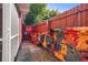 Kayaks are stored in the backyard, beside a red fence at 10941 Oakdale Ave, Port Richey, FL 34668