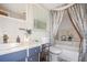 Bathroom with tub shower combination and updated vanity at 10941 Oakdale Ave, Port Richey, FL 34668
