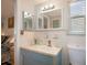 Clean bathroom with updated vanity and mirror at 10941 Oakdale Ave, Port Richey, FL 34668