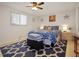 Bright bedroom with a comfortable bed and stylish decor at 10941 Oakdale Ave, Port Richey, FL 34668