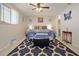 Spacious bedroom with a queen-size bed, ceiling fan, and ample closet space at 10941 Oakdale Ave, Port Richey, FL 34668