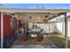 Covered carport with space for two motorcycles and extra storage at 10941 Oakdale Ave, Port Richey, FL 34668