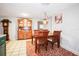 Cozy dining area with wooden table and hutch at 10941 Oakdale Ave, Port Richey, FL 34668