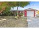Charming red house with a well-maintained lawn and a spacious driveway at 10941 Oakdale Ave, Port Richey, FL 34668