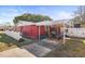 Red house with carport and motorcycle parking at 10941 Oakdale Ave, Port Richey, FL 34668