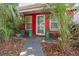 Welcoming front porch with decorative railing and entryway at 10941 Oakdale Ave, Port Richey, FL 34668