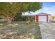 Charming ranch-style home with mature landscaping and a spacious yard at 10941 Oakdale Ave, Port Richey, FL 34668