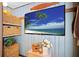 Charming media room features built-in shelving and a large flatscreen TV at 10941 Oakdale Ave, Port Richey, FL 34668