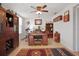 Home office with built in shelving and hardwood floors at 10941 Oakdale Ave, Port Richey, FL 34668