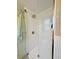 Spacious shower with white subway tile and glass door at 10941 Oakdale Ave, Port Richey, FL 34668