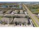 Wide aerial view of townhouses, roads, and neighboring buildings at 1115 Andrew Aviles Cir, Tampa, FL 33619