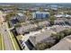 An aerial view showing a neighborhood of townhouses and nearby amenities at 1115 Andrew Aviles Cir, Tampa, FL 33619