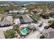 Aerial view of townhouses with pool and surrounding landscape at 1115 Andrew Aviles Cir, Tampa, FL 33619
