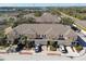 Aerial view of townhouses with attached garages and neatly landscaped grounds at 1115 Andrew Aviles Cir, Tampa, FL 33619
