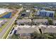 Aerial view of townhouses, highlighting their location near a hotel and main road at 1115 Andrew Aviles Cir, Tampa, FL 33619