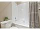 Clean bathroom with a shower/tub combo, granite vanity, and updated fixtures at 1115 Andrew Aviles Cir, Tampa, FL 33619
