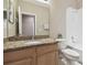 Bathroom with granite countertop, toilet, and bathtub at 1115 Andrew Aviles Cir, Tampa, FL 33619