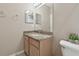 Bathroom features granite countertop, sink, and mirrored medicine cabinet at 1115 Andrew Aviles Cir, Tampa, FL 33619