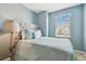 Bedroom with light blue walls and a neutral comforter at 1115 Andrew Aviles Cir, Tampa, FL 33619