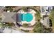 Bird's-eye view of community pool with surrounding patio and landscaping at 1115 Andrew Aviles Cir, Tampa, FL 33619