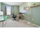 Home office with a desk, chair, and ample natural light at 1115 Andrew Aviles Cir, Tampa, FL 33619