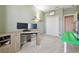 Home office featuring a large desk, dual monitors, and closet at 1115 Andrew Aviles Cir, Tampa, FL 33619
