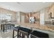 Open concept kitchen with breakfast bar and dining area at 1115 Andrew Aviles Cir, Tampa, FL 33619