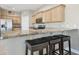Kitchen island with granite countertop and breakfast bar seating at 1115 Andrew Aviles Cir, Tampa, FL 33619