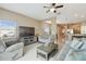 Spacious living room with gray sofas and large TV at 1115 Andrew Aviles Cir, Tampa, FL 33619